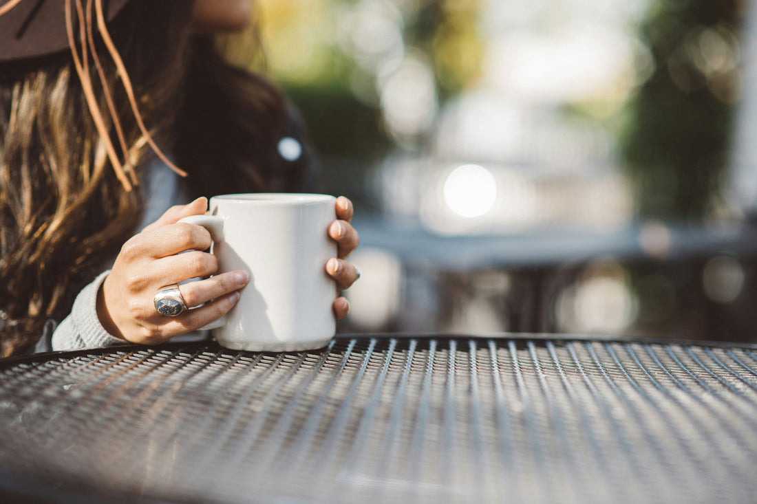 woman starting the day with a hot beverage