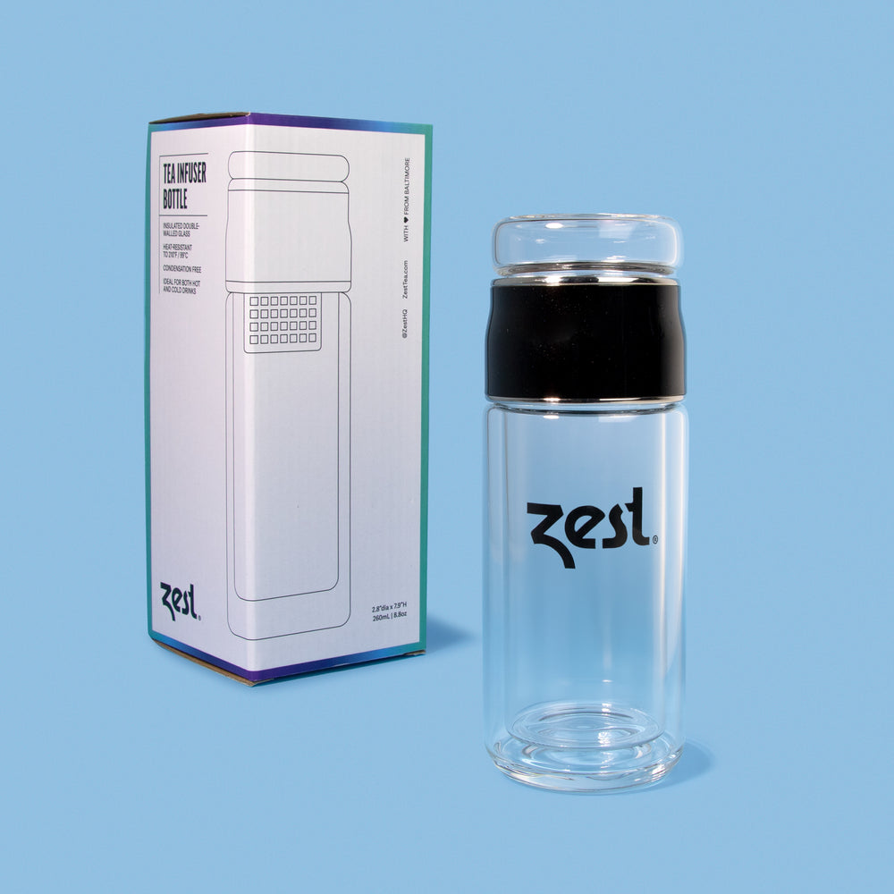 Zest tea infuser bottle with packaging box back view on blue background