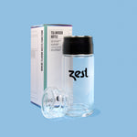Zest tea infuser bottle with packaging box front view on blue background