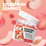 Zest Colostrum Gummies jar open with peach gummies on pink background