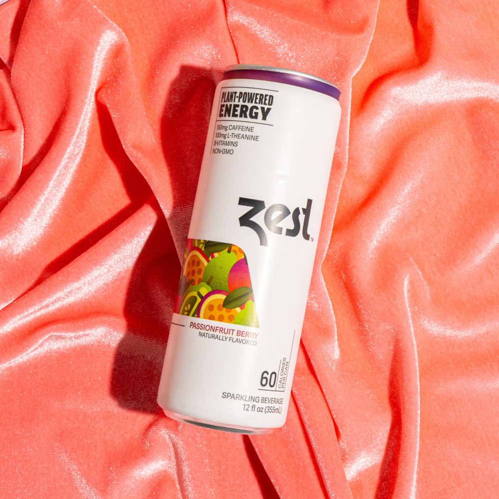 Zest Passionfruit Berry sparkling can on coral satin fabric